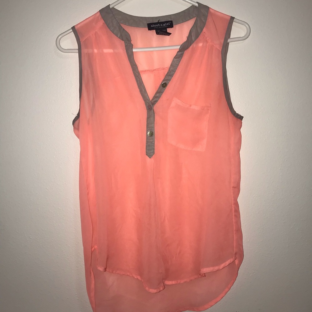 Sheer pink button-up tank top.